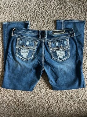 Rock Revival Women's Dark Blue Boot Cut Jeans with Distressed Pocket Detail